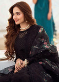Sana Javed sitting in NUREH black lawn suit with floral organza dupatta