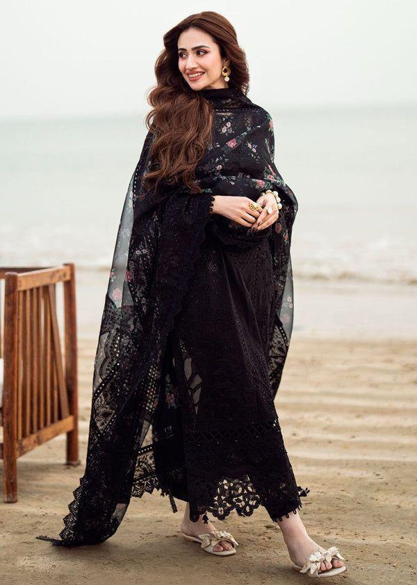 Sana Javed in NUREH black embroidered suit with pearl jewelry full view