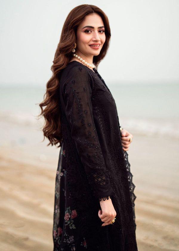 Sana Javed in NUREH black embroidered suit with pearl jewelry full view