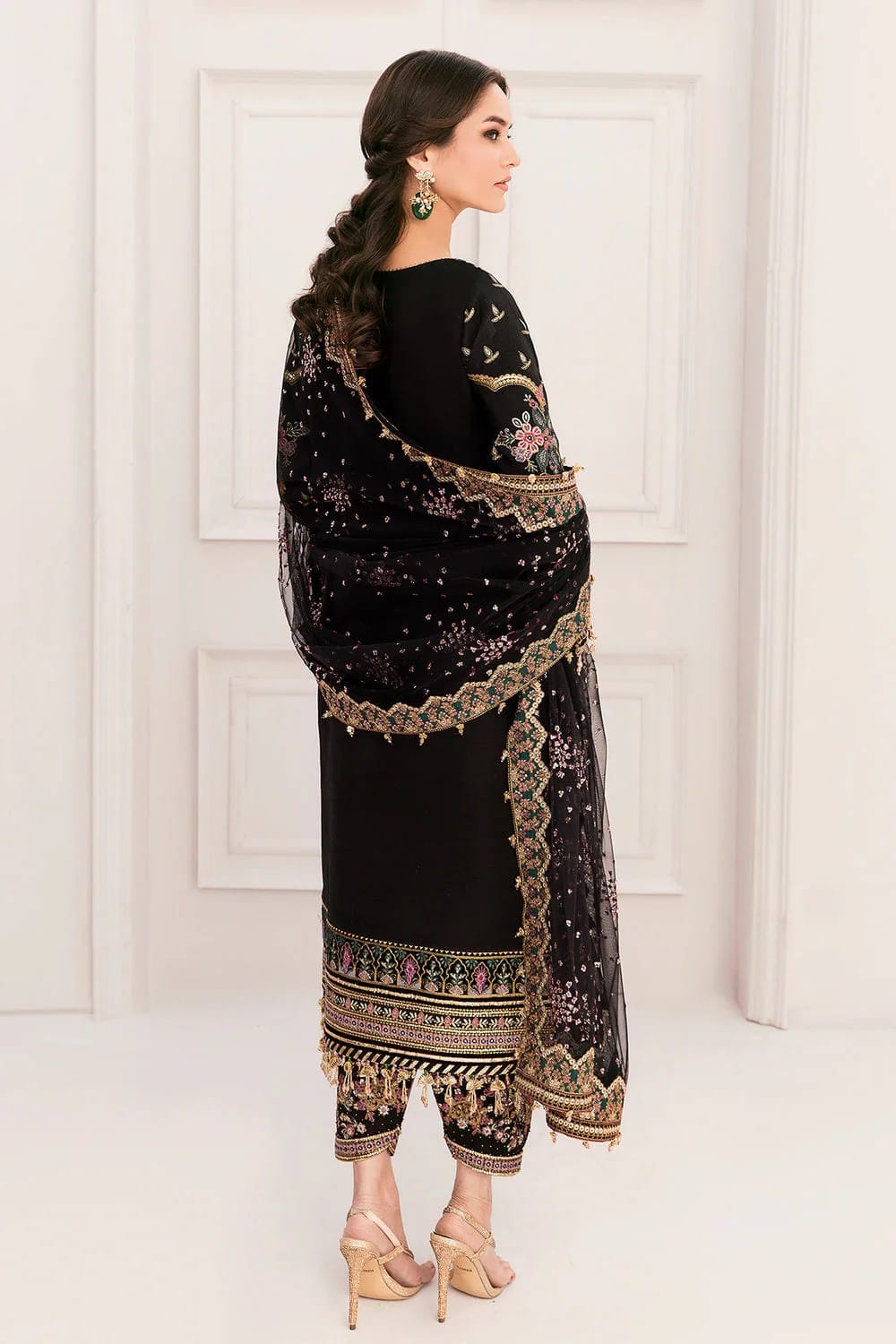 "Back view of Baroque black bridal suit showing embroidered sleeves and 4-sided bordered net dupatta"